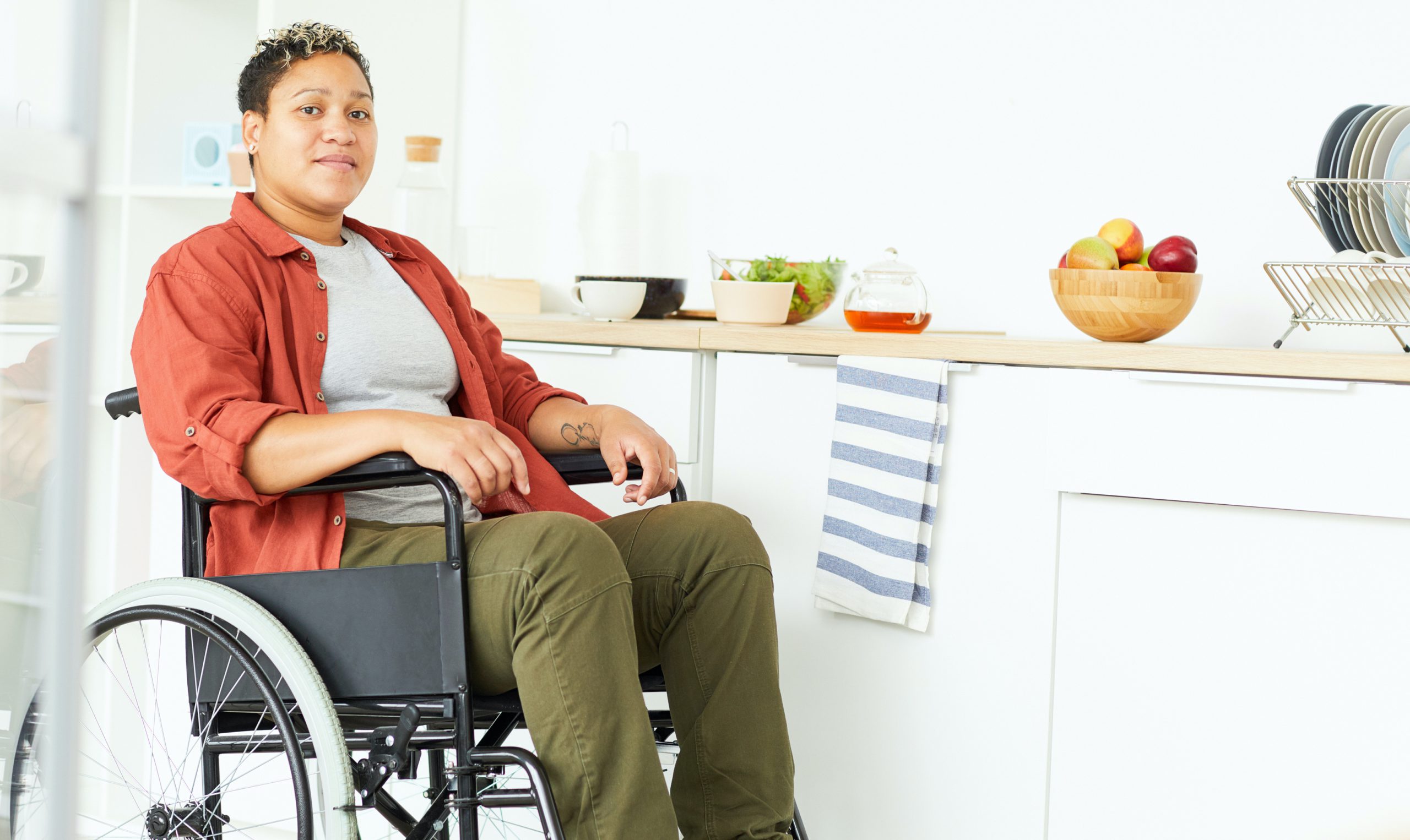 Woman in wheelchair at home
